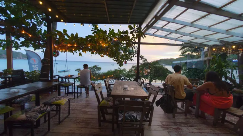 Guests on terrace watching sunset